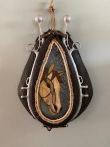 Horse stained glass mounted on a horse collar