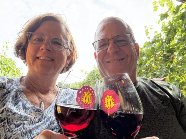 Two people with glasses of wine