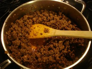 Meat cooking in a pan